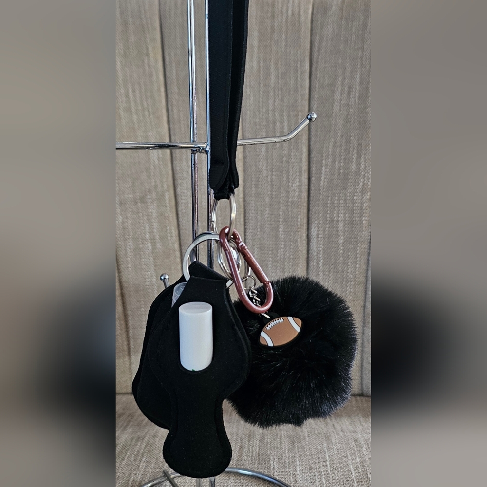 Black Keychain with Football Charm Comes With Peach Lip Care And Sanitizer. NEW